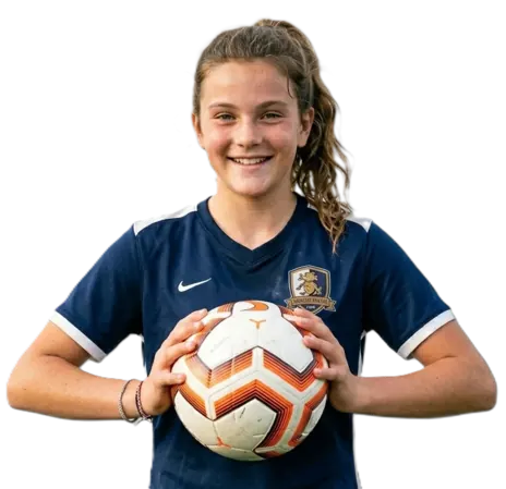 Youth soccer player dribbling with team crest jersey