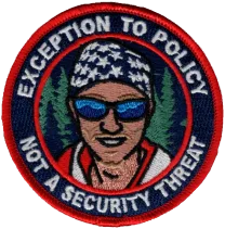 Embroidered round morale patch with a face in a stars-and-stripes beanie and sunglasses
