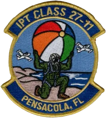 Embroidered naval aviation training class patch with a pilot holding a beach ball
