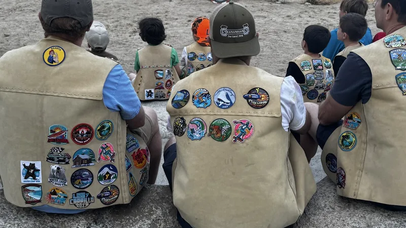 A scouting pack in vests covered with patches